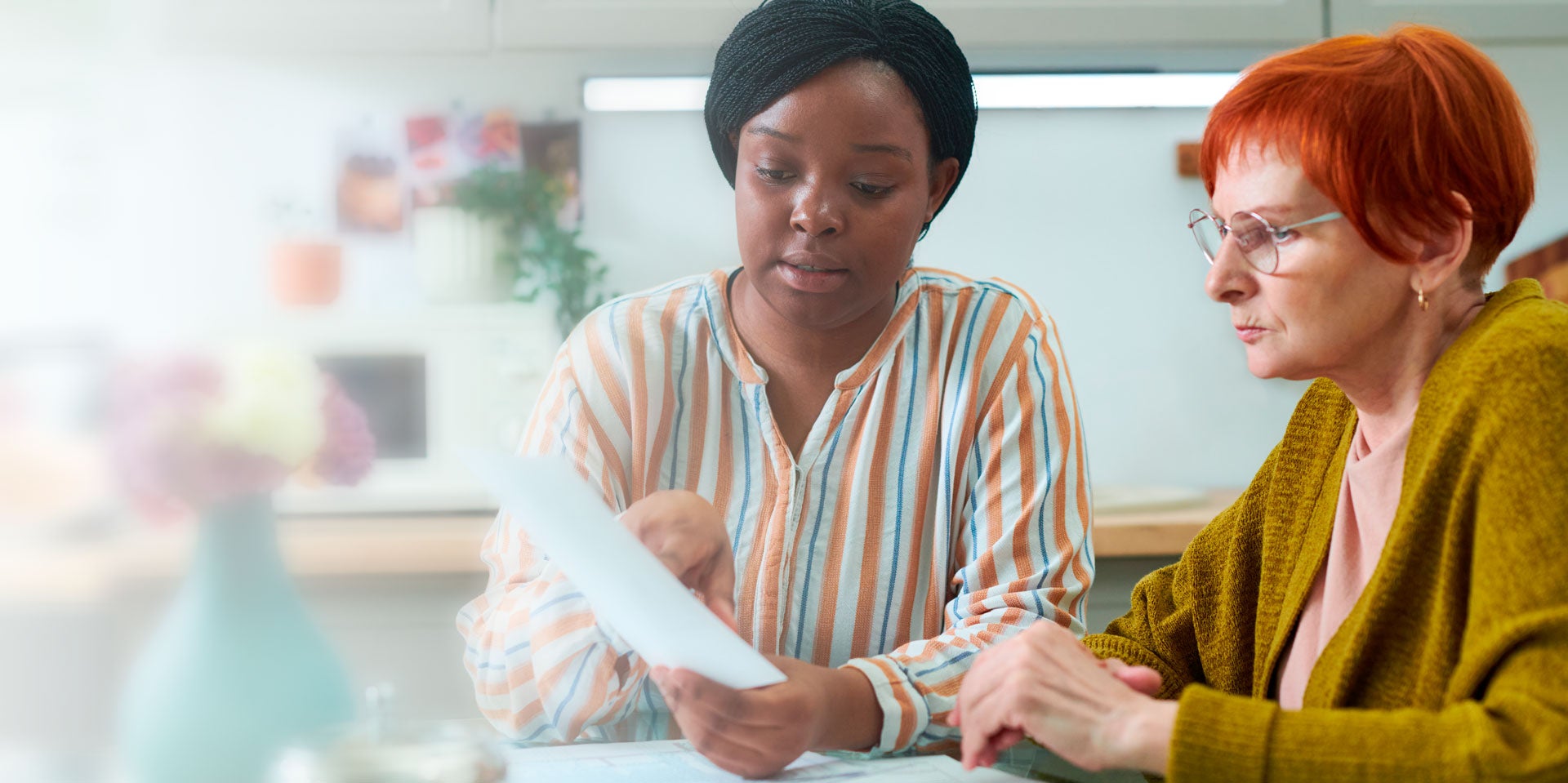 Two women reviewing paperwork